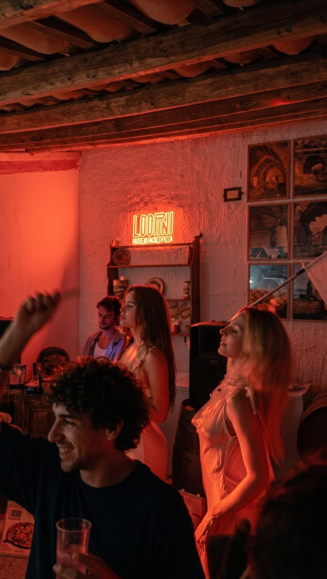 Dancing under the Loopini neon sign
